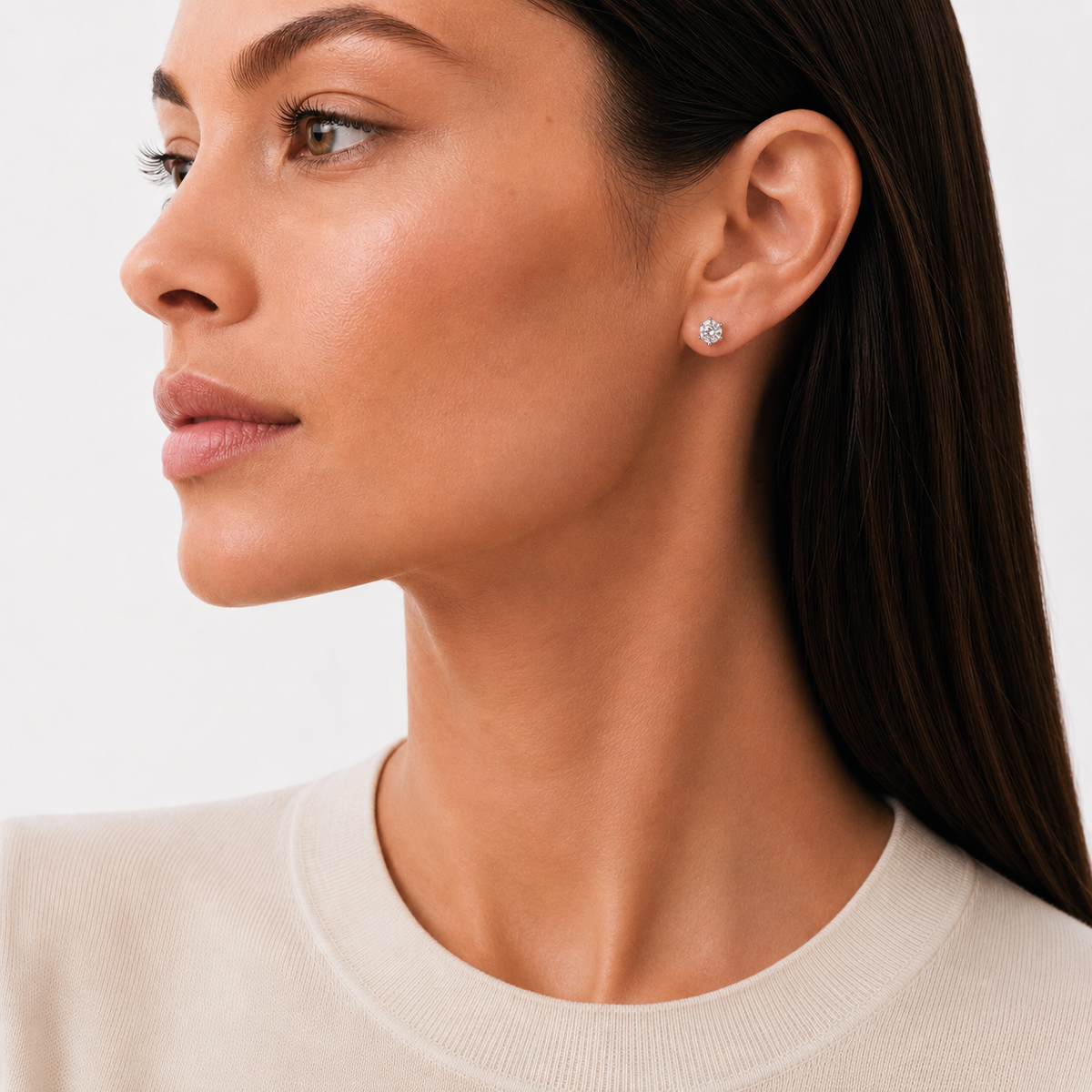 model wears 0.5ct Moissanite Six-Prong Stud Earrings, white gold plated sterling silver