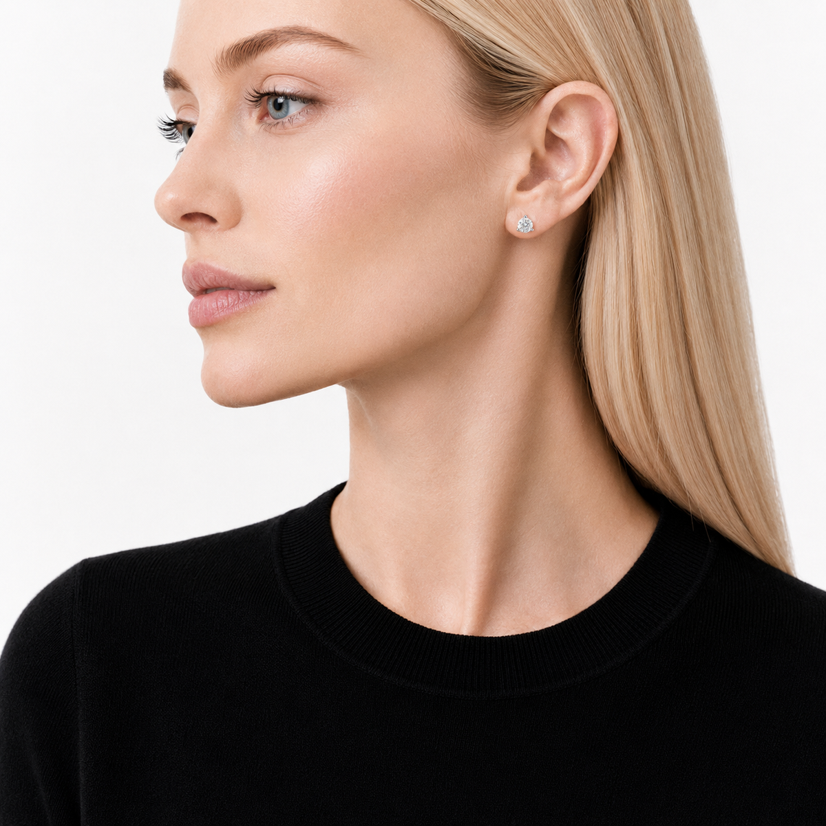 model wears 0.5ct Moissanite Three-Prong Stud Earrings, white gold plated sterling silver