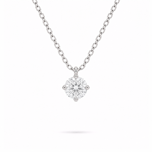 A round brilliant cut moissanite weighing 0.5ct in a classic solitaire necklace, white gold plated sterling silver