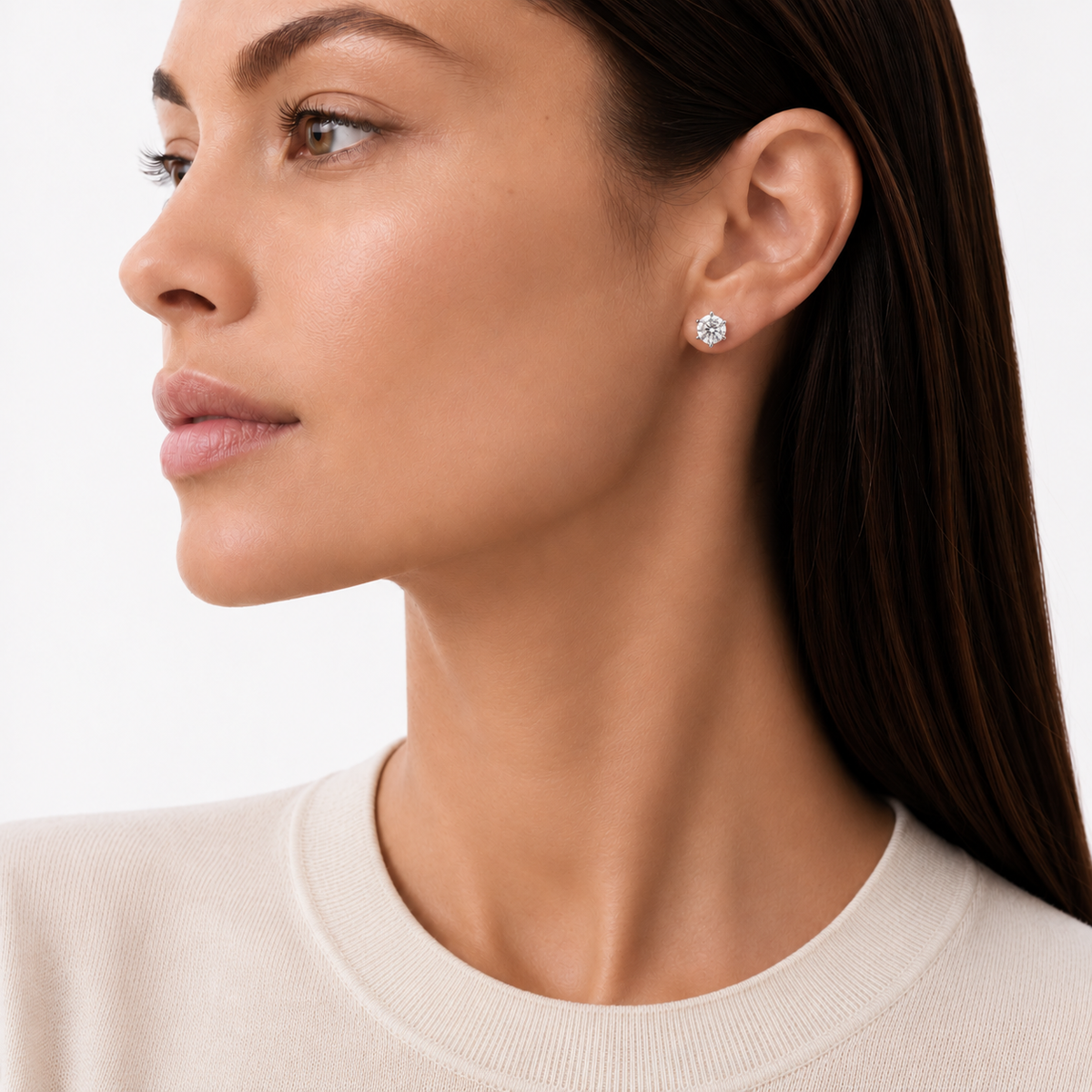 model wears 1ct Moissanite Six-Prong Stud Earrings, white gold plated sterling silver