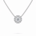 A round brilliant cut moissanite weighing 1ct is framed by a halo of round brilliant cut moissanite, white gold plated sterling silver