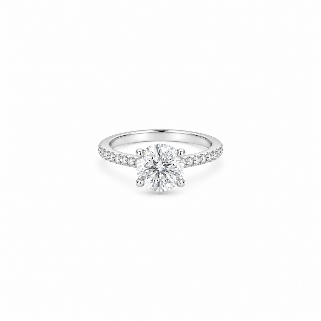 A 2ct round brilliant cut moissanite solitaire ring with a pavé band, white gold plated sterling silver 