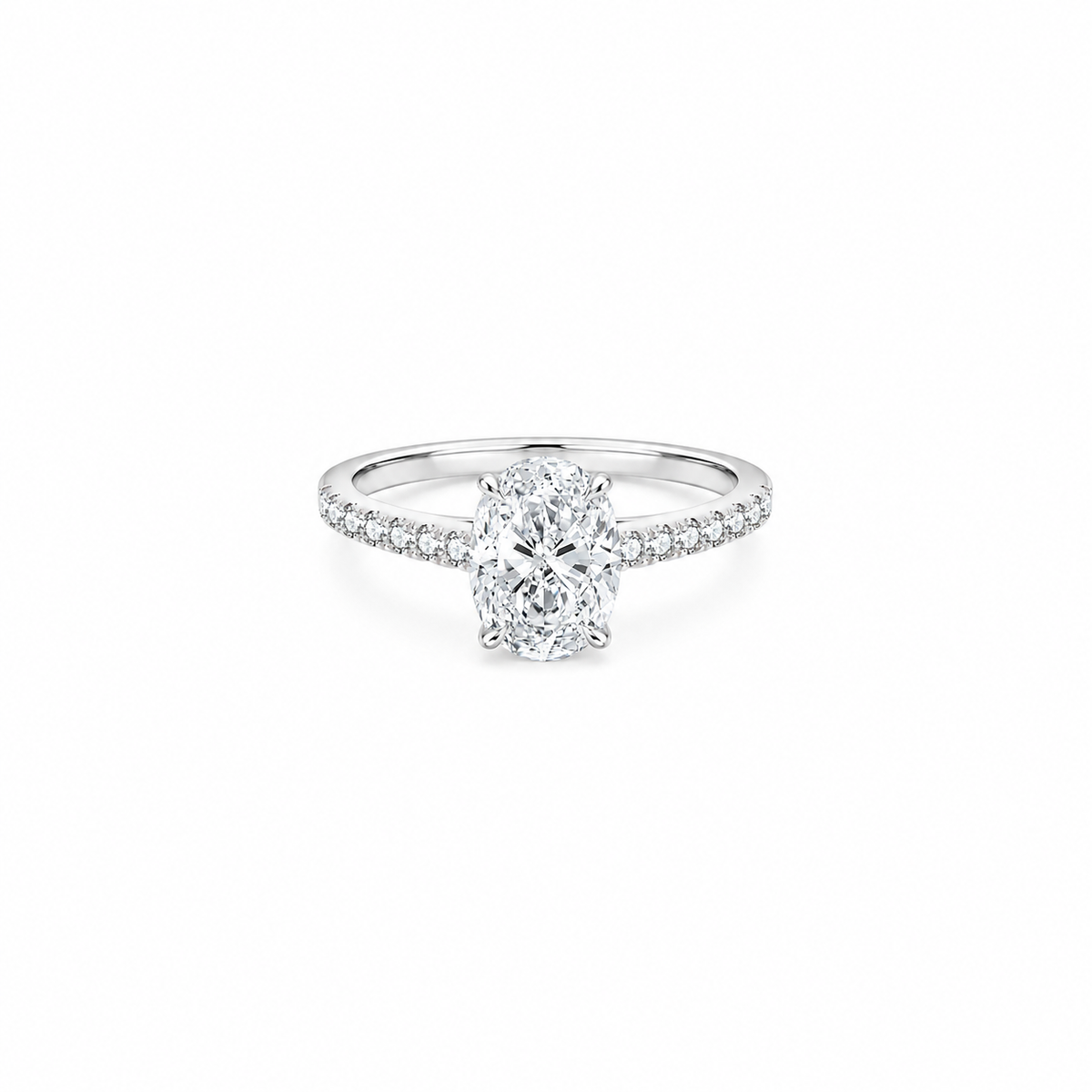 An oval cut moissanite weighing 2ct, accompanied by pavé set stones along the band, white gold plated sterling silver