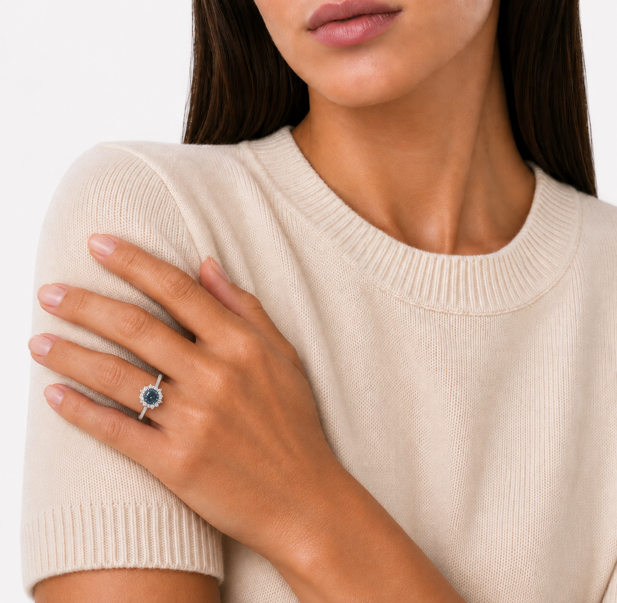 model wears Blue Moissanite Halo Ring, platinum plated sterling silver