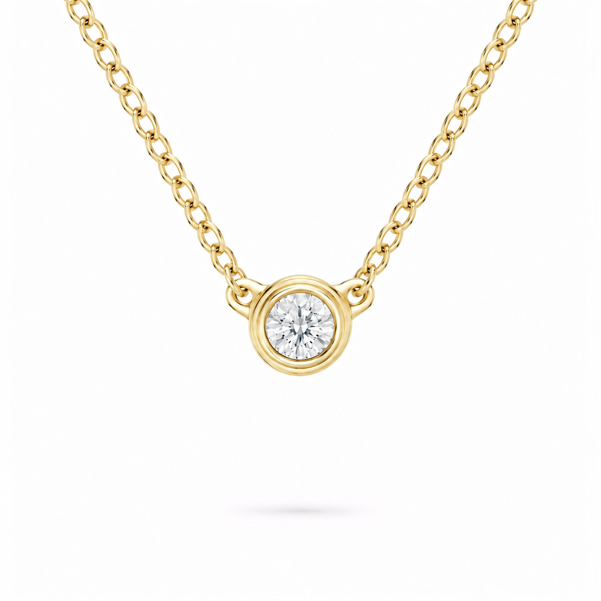 gold bezel necklace in yellow gold plated sterling silver with moissanite