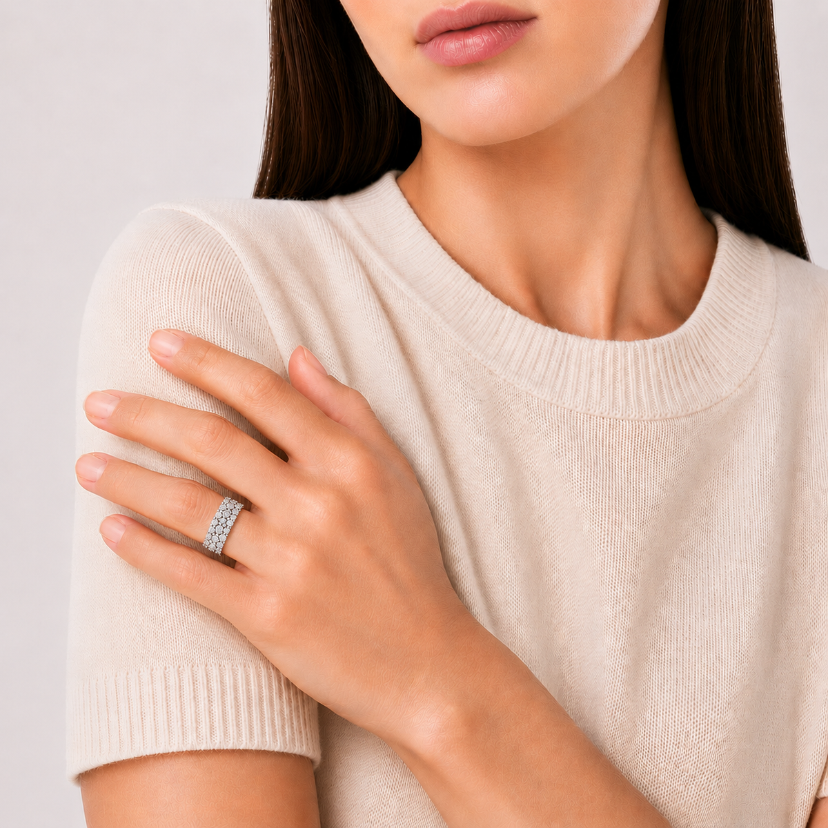 model wears Moissanite Triple Row Bezel Band Ring, platinum plated sterling silver