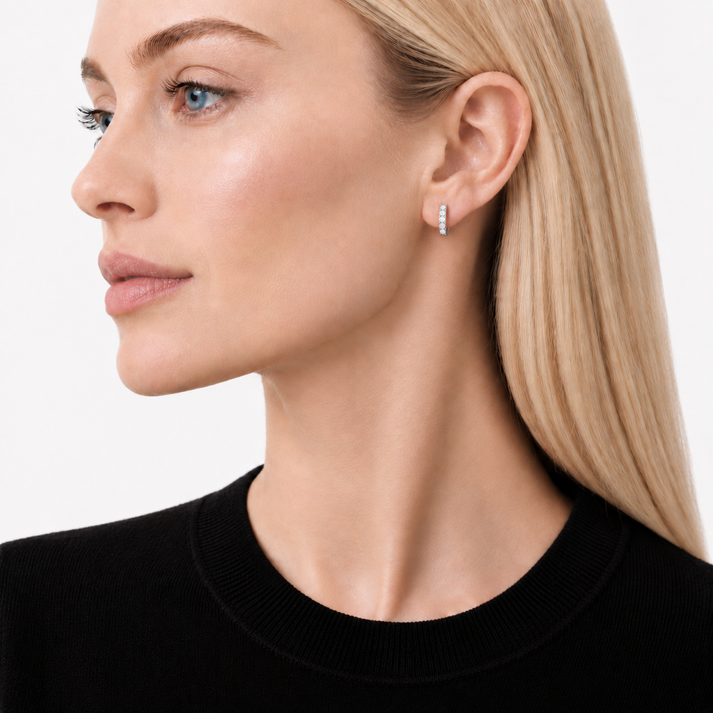 Model wearing moissanite sterling silver Pavé Huggie Earrings by knightley