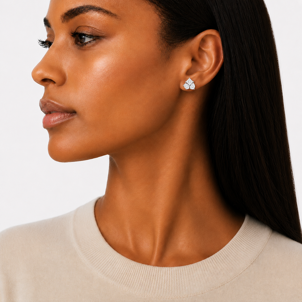 model wears Trio Moissanite Stud Earrings with princess cut, pear cut and oval cut moissanite stones, sterling silver