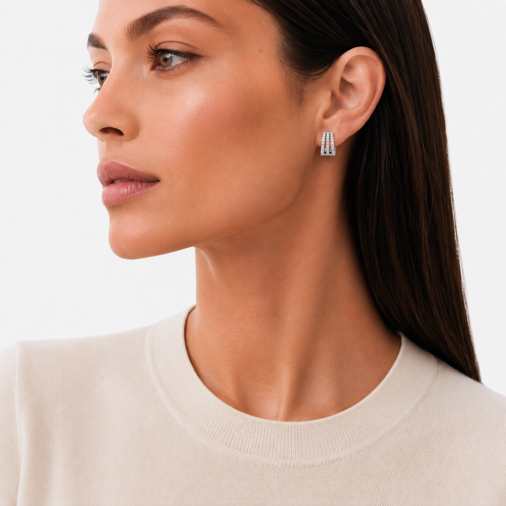 model wears Triple Row Moissanite Pavé Huggie Earrings, sterling silver