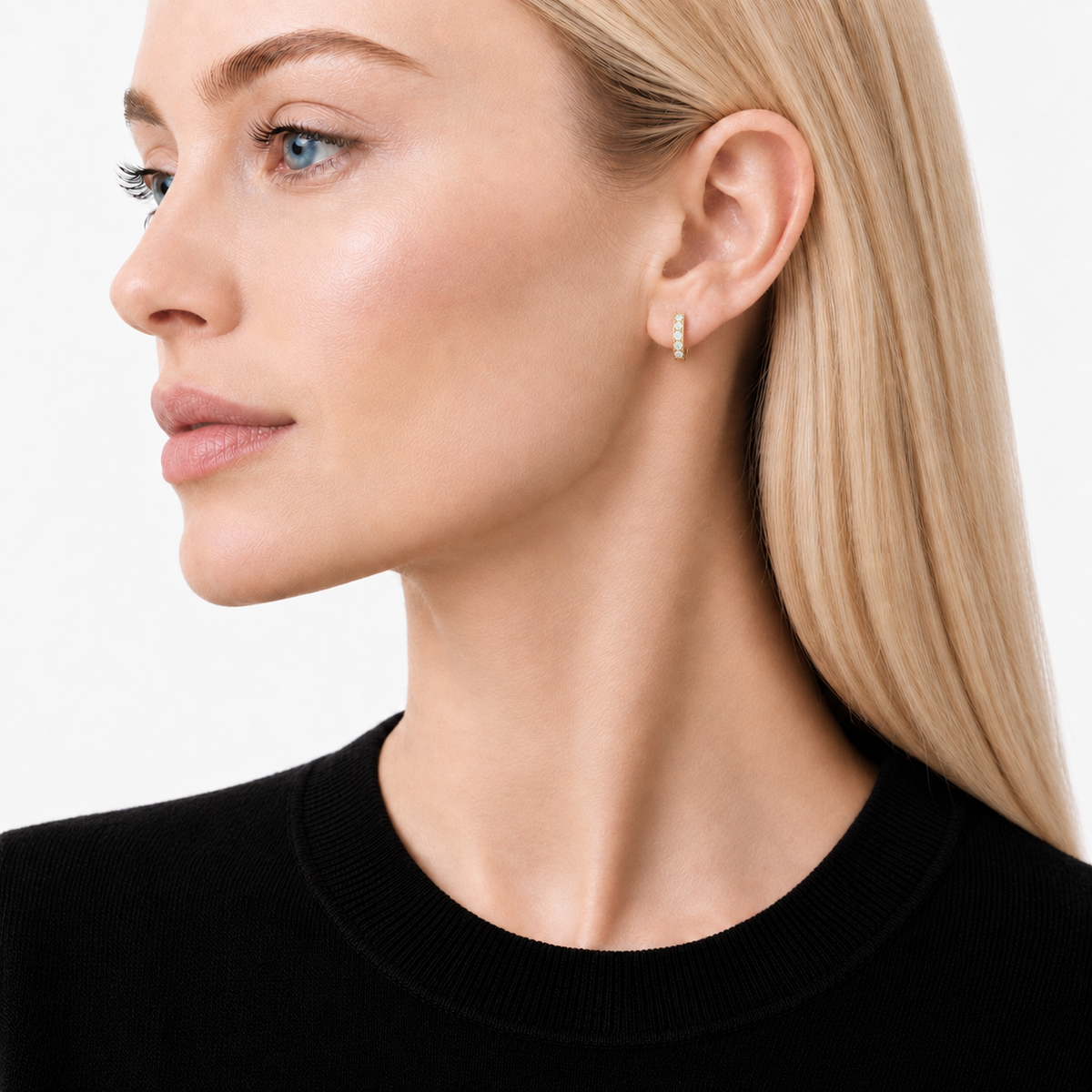 Model wearing moissanite Gold Pavé Huggie Earrings by knightley