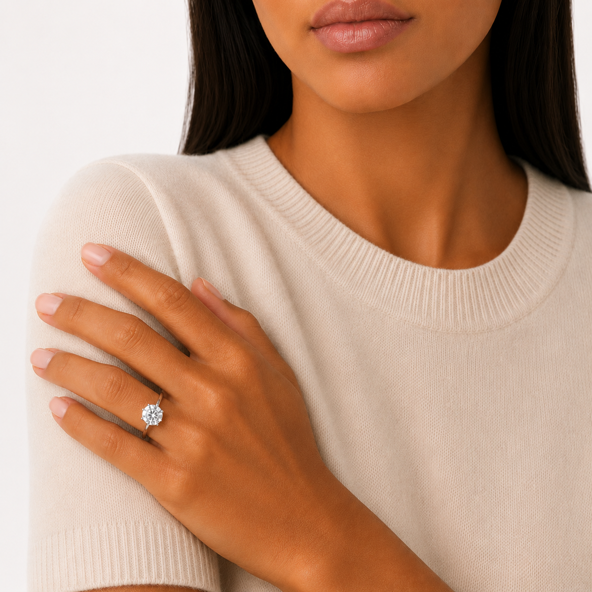 model wearing 2ct moissanite Classic Solitaire Ring, white gold plated sterling silver