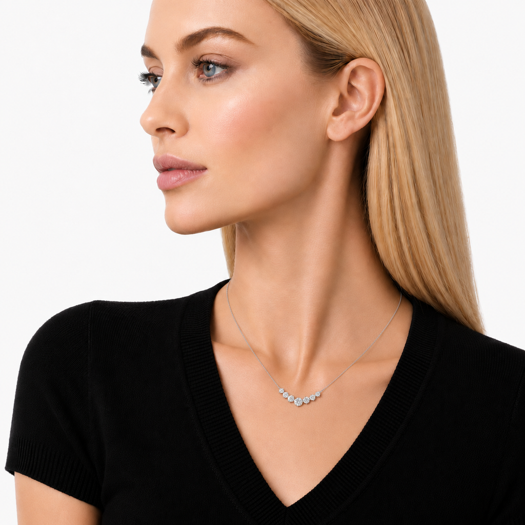 model wears 7 moissanite stones in pendant necklace, sterling silver